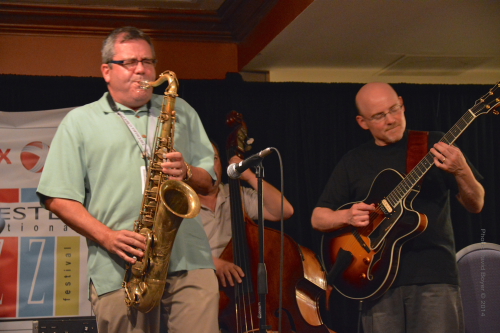 l-r John Nugent on sax, Co-Producer/Artistic Director of the XRIJF jams with his long time friend Bob Sneider on guitar at the "After Party" jam session. 